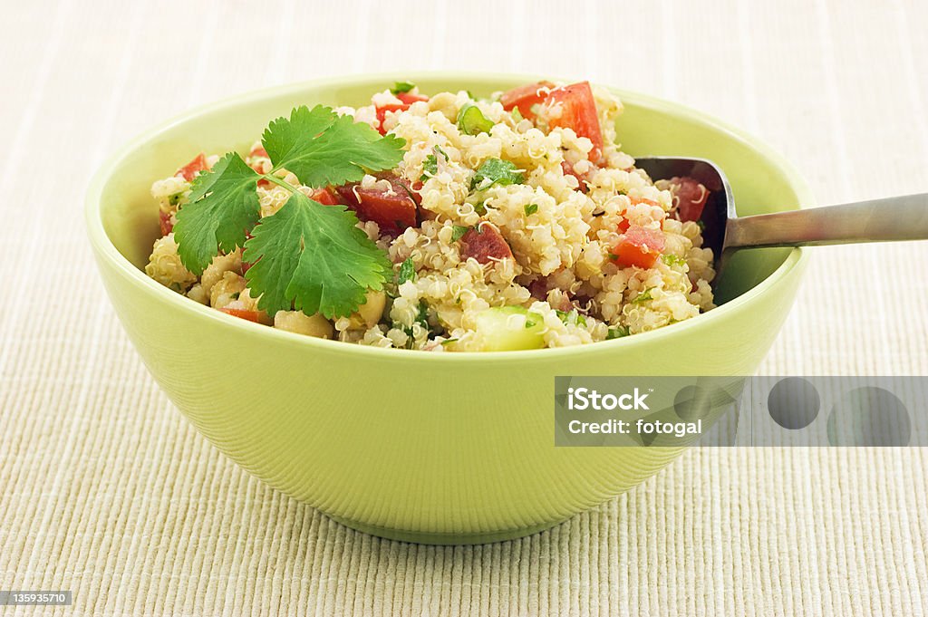 Healthy Quinoa salad Healthy Quinoa salad in bright green bowl Antioxidant Stock Photo