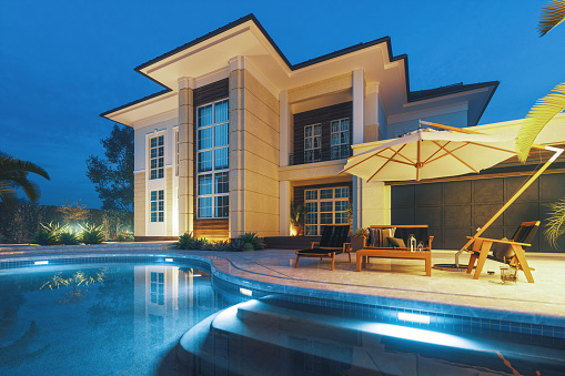 Moderna casa de lujo con piscina privada al amanecer photo