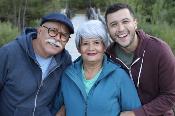 istock Two-generation Hispanic family outdoors 1359359838
