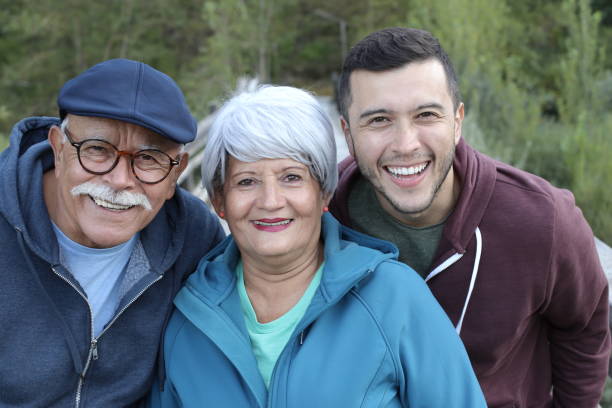 istock Two-generation Hispanic family outdoors 1359359866