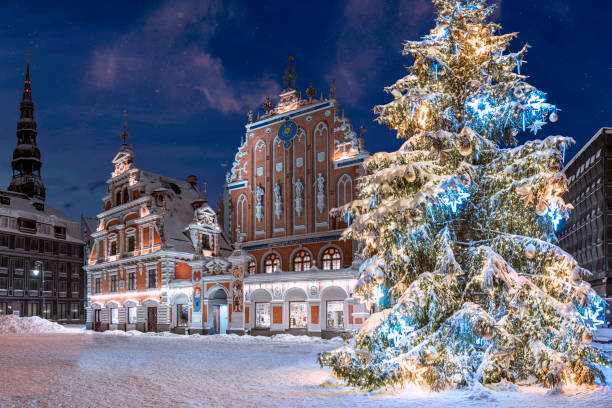 Town Hall square with House of the Blackheads and Christmas tree in winter stock photo
