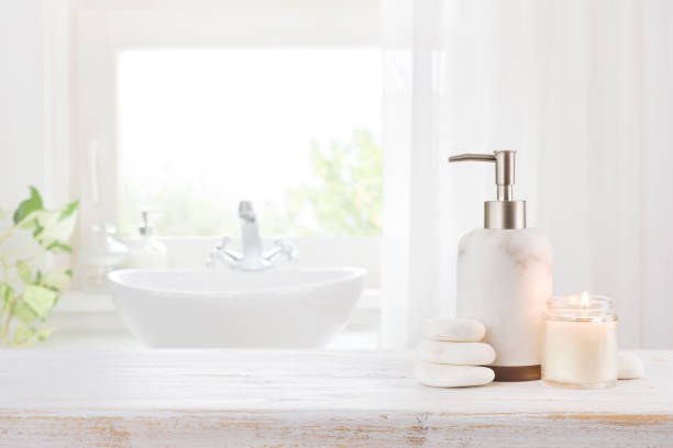 istock Spa aromatic candle, stones and dispenser on old wooden table 1359360109
