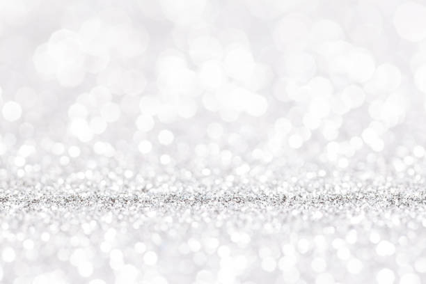 istock sparkles of Silver glitter abstract background. Copy space 1359364373