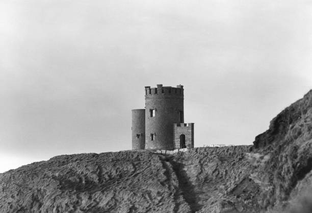 Burry, Ireland - August 4, 2013: Clare county, visitors near the O'Brian tower in the north area of the Cliffs of Moher
