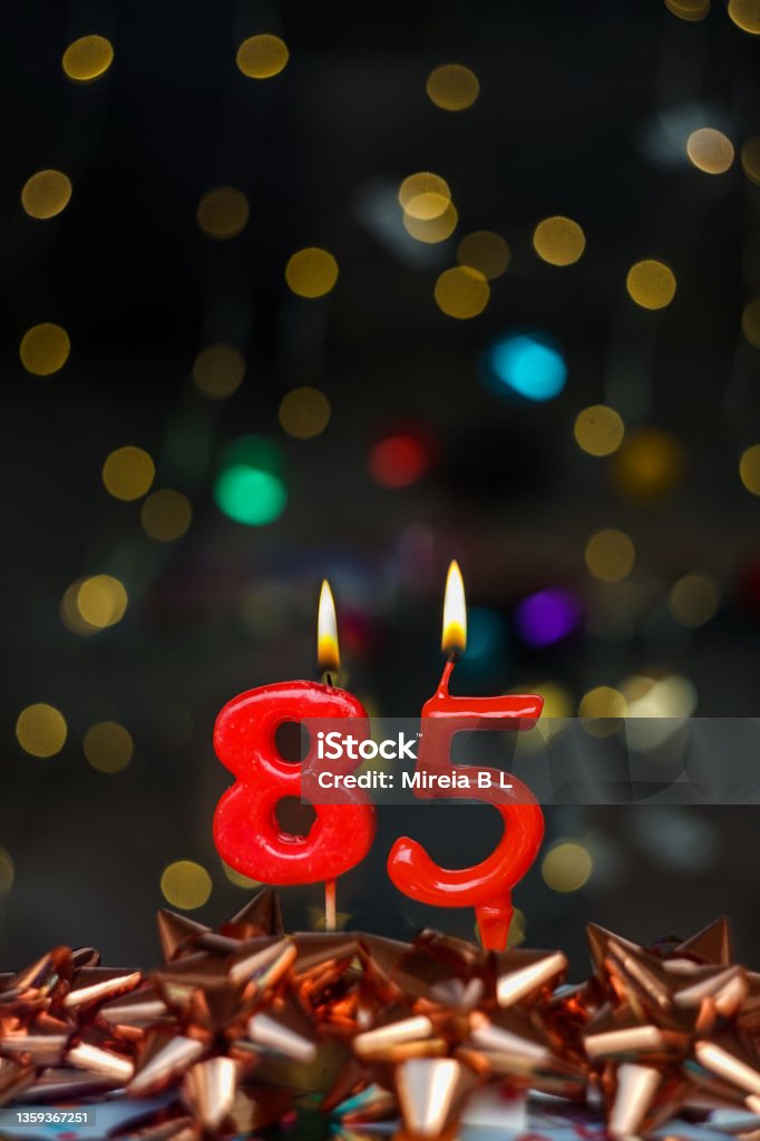 Number 85 Joyful greeting card for birthdays or anniversaries. This image is part of a serie of photos of different numbers burning candles that goes from 1 to 100 Burning candles in the middle of an illuminated colorful background. For images with candles with other numbers, see my profile. 85th Annual Academy Awards Stock Photo
