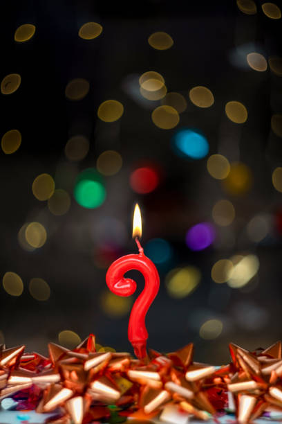 istock Question mark Joyful greeting card for birthdays or anniversaries. This image is part of a serie of photos of different numbers burning candles that goes from 1 to 100 (including this question mark) 1359367988