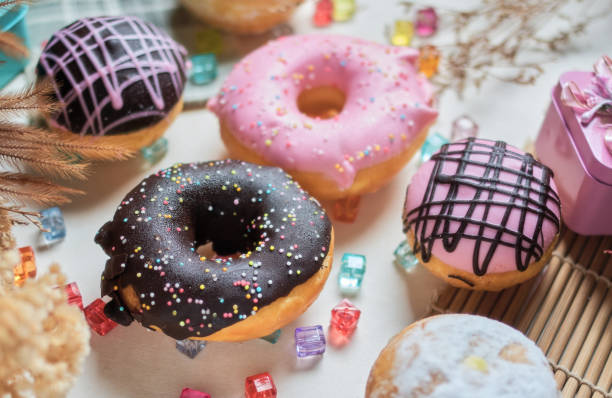 istock The various colors and taste glazed donuts on the table 1359369484