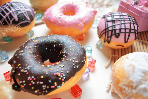 istock The various colors and taste glazed donuts on the table 1359369487