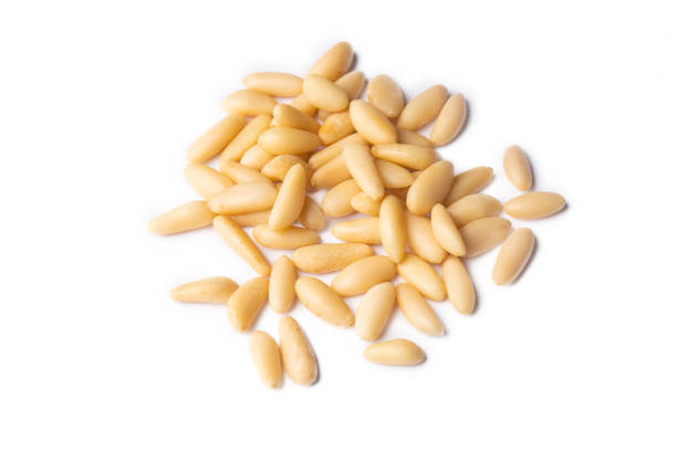 istock Healthy pine nuts isolated on white background. 1359371802