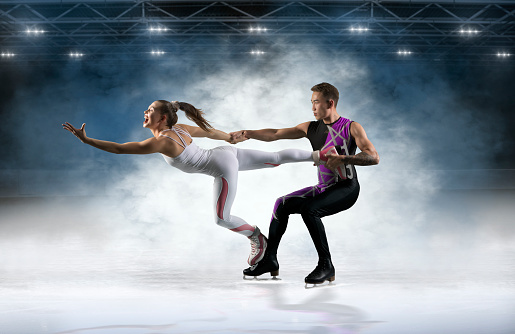 Duo figure skating in action on dark background. Sports banner. Horizontal copy space background