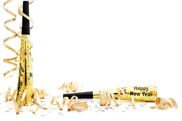 New Years Eve party noisemaker border over a white background