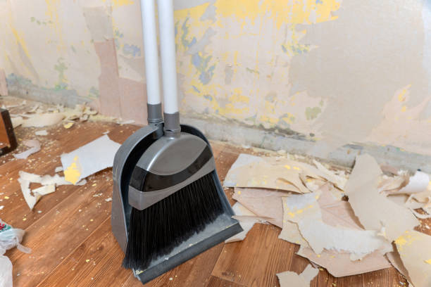 istock Clean up garbage after repairs.Sweep up construction debris with a brush in a dustpan.Sweeping at home.Tools for cleaning the house.Make home repairs.The dust and debris after the renovation.Handyman 1359374702