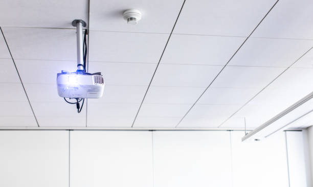 istock A white overhead projector on ceiling in a conference room 1359375276