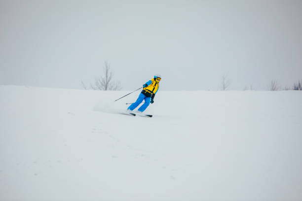 istock woman skier at ski slope 1359375557