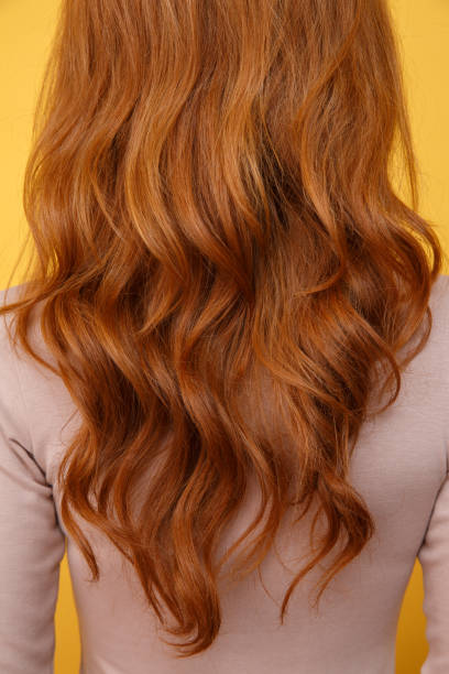 istock Back view photo of young redhead lady 1359376949