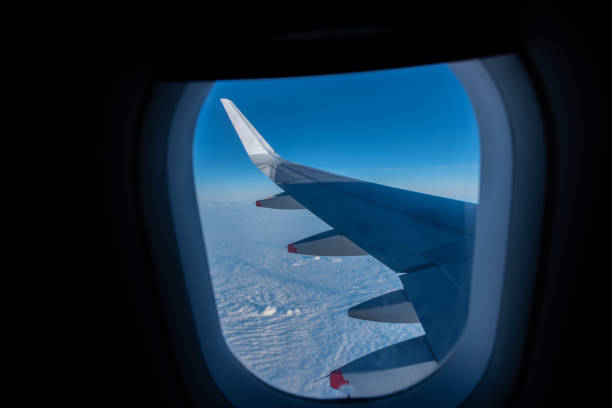 istock View of the sky from inside an airplane in flight. 1359377246
