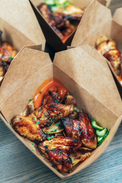 istock Chicken Wings Packed To take away 1359378149