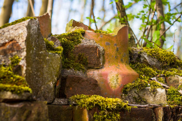 ceramic fragment among antique stones in fireplace spring landscape