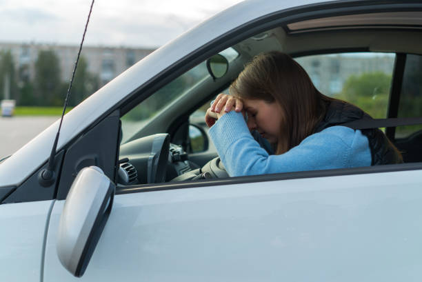 istock Broken off side rearview mirror on car. Driver woman sad after accident 1359379231