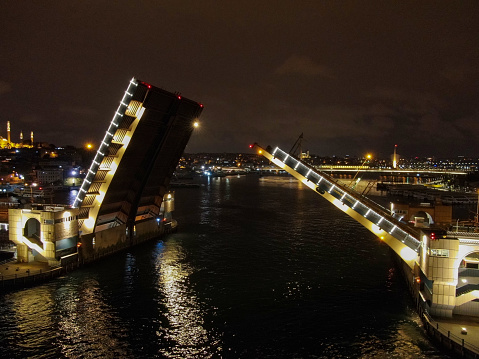 Opening of galata drawbridge. Night view of Galata bridge from the Istanbul Bosphorus. istanbul, Turkey