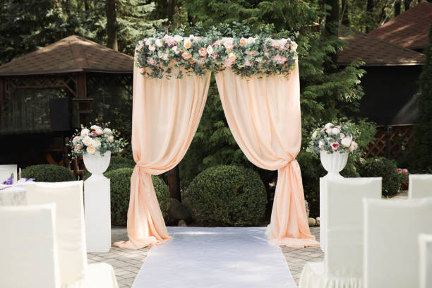 istock Beautiful wedding arch for an exit ceremony with flowers 1359380782