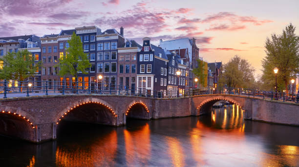 istock Amsterdam, Netherlands. Autumn sunset scene with scenic channels 1359382034