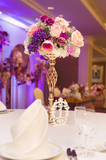 istock Beautiful wedding table setting with gold, flowers and beads. 1359382200