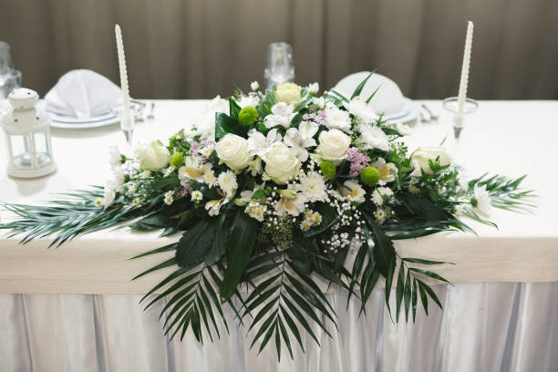istock Wedding floral decor in white at a banquet in a restaurant. 1359382244