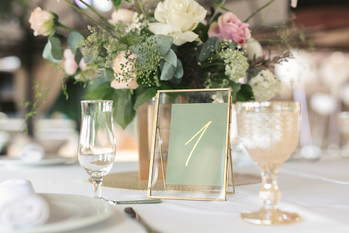 Wedding decor with white and green colors . Wedding table decoration.