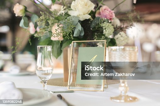 istock Guest table number. Wedding table in the restaurant. 1359382248