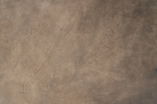 istock Seamless brown concrete texture. Stone wall background 1359382690