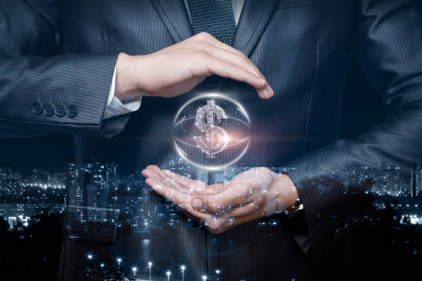 Investment protection concept. A businessman protects a dollar with a hands gesture.