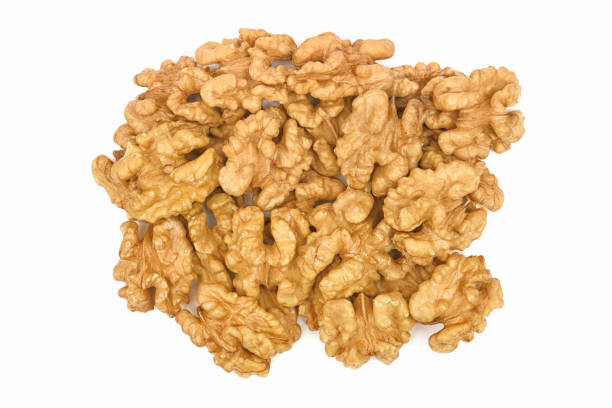 istock Pile of walnuts isolated on white background. Walnut without shell close-up top view. Nuts collection 1359384930