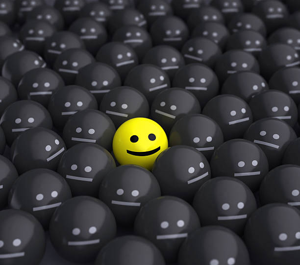 istock smile in the middle of grey crowd 135938649