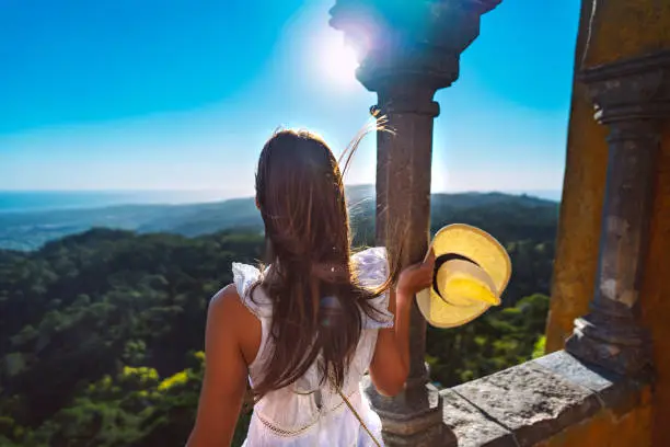 Tourist woman enjoying freedom and beautiful mountains view in Sintra. Inspirational moment of life. High quality photo