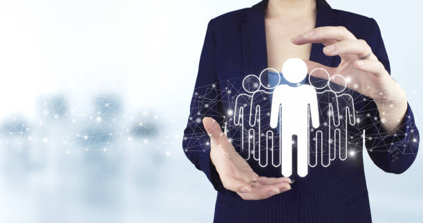istock Business communication concept. Marketing. Teamwork. Two hand holding virtual holographic Human, Leader icon with light blurred background. Community, unity, people and support concept. 1359394898