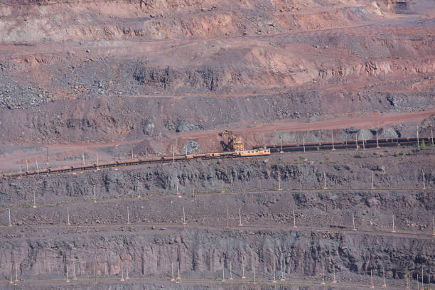 istock Heavy duty train in metal ore quarry 1359396381