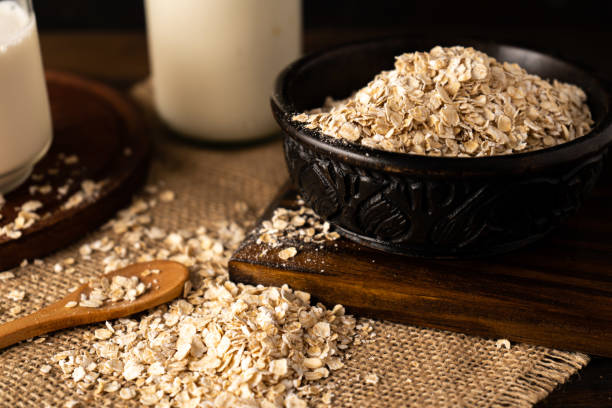 istock Close-up of a bowl with oatmeal on a kitchen table. Chopped sight. 1359398415