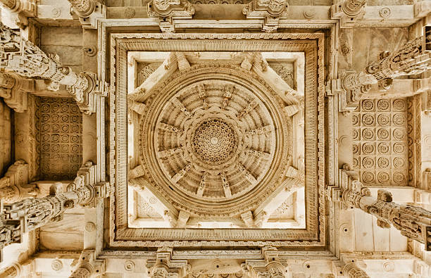 Adinatha Temple in Ranakpur, India Vaulted ceiling of Ranakpur (India) - toned in sepia jainism photos stock pictures, royalty-free photos & images