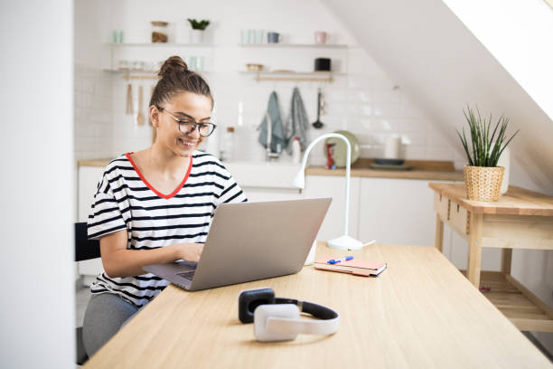 istock Girl enjoying her freelance work at the home office 1359401563