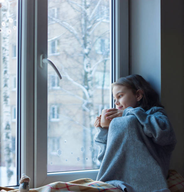 istock The girl is holding a mug in her hands 1359402991