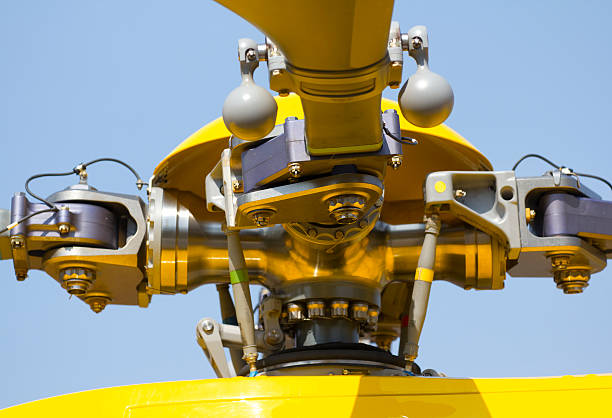 Powerful propeller and blades of a military helicopter against the background of a bright blue sky