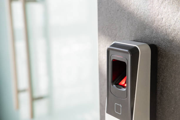 istock Fingerprint scanner on the wall in the office space. Modern technology concept 1359407534
