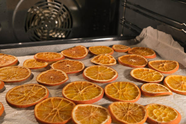 istock Drying orange slices at home for handmade winter/ Christmas decorations 1359408323