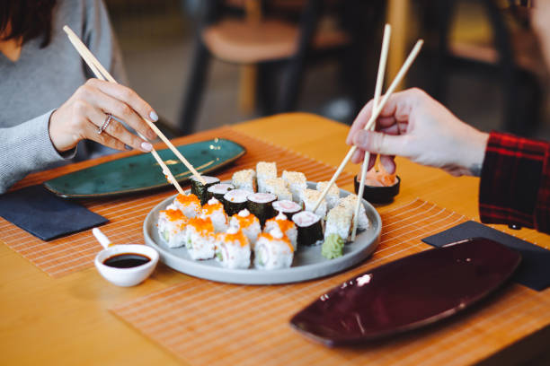istock Friends enjoying meal 1359408335