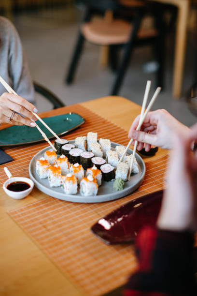 istock Friends enjoying meal 1359408379
