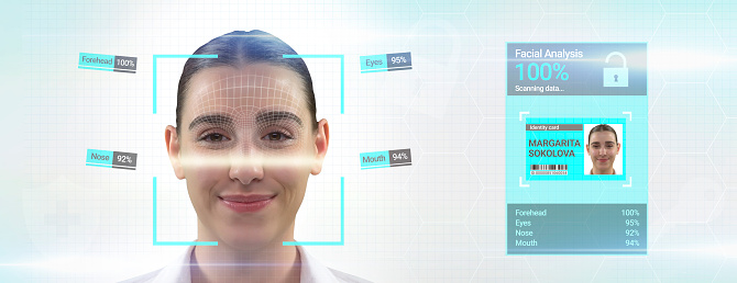 Biometric scanner is scanning face of young woman. Artificial intelligence concept.  young woman using digital biometric id face scanner, Woman facial recognition technology concept GUI for authentication