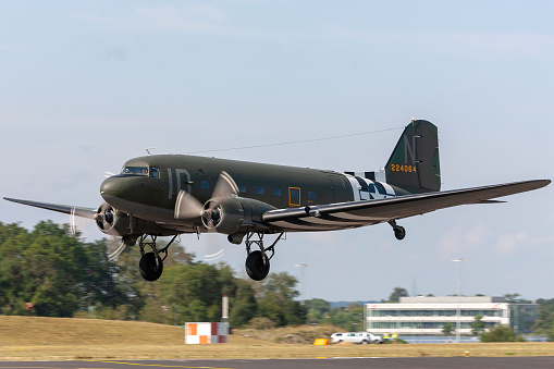 Farnborough, UK - July 20, 2014: Vintage World war II era Douglas C-47 (DC-3) transport aircraft departing Farnborough Airport.