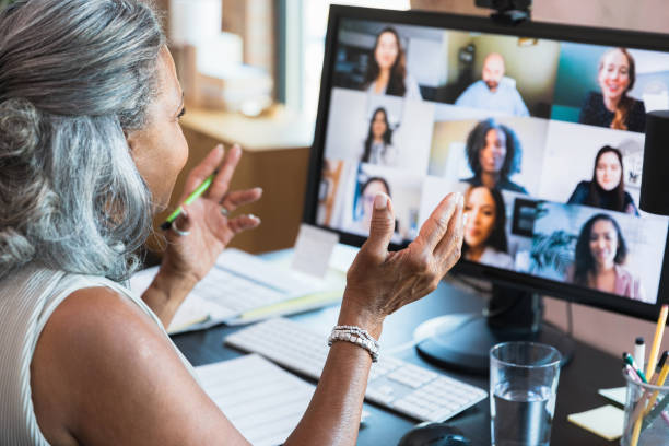istock Senior accountant gestures while leading virtual meeting 1359410933
