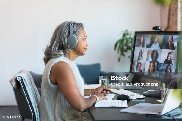 Senior Ceo Leads Meeting With Employees From Home Stock Photo - Download Image Now - Video Call, Senior Adult, Virtual Event